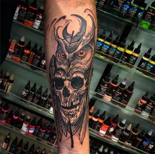 abstract owl skull tattoo man forearm