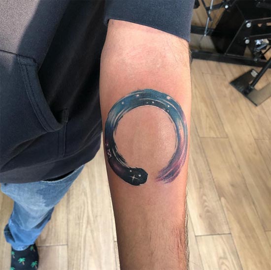 enso sky abstract tattoo design male hand forearm color