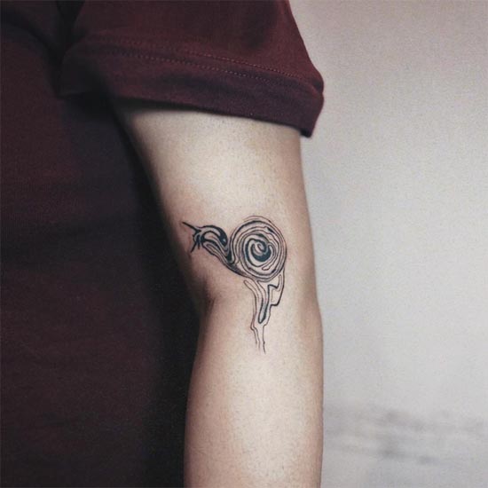 snail abstract liquid tattoo female arm
