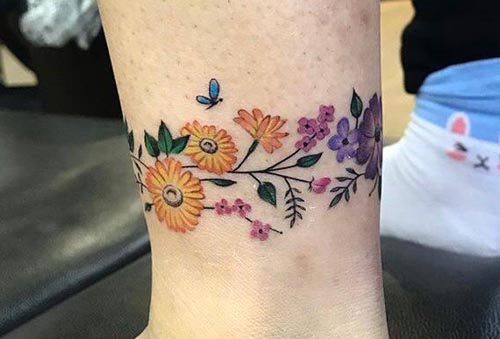 colorful flower band tattoo on ankle