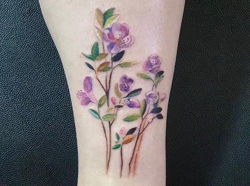 colorful flowers tattoo on ankle