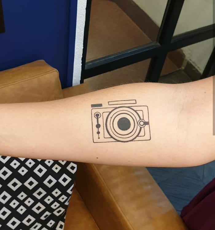 camera tattoo design on arm