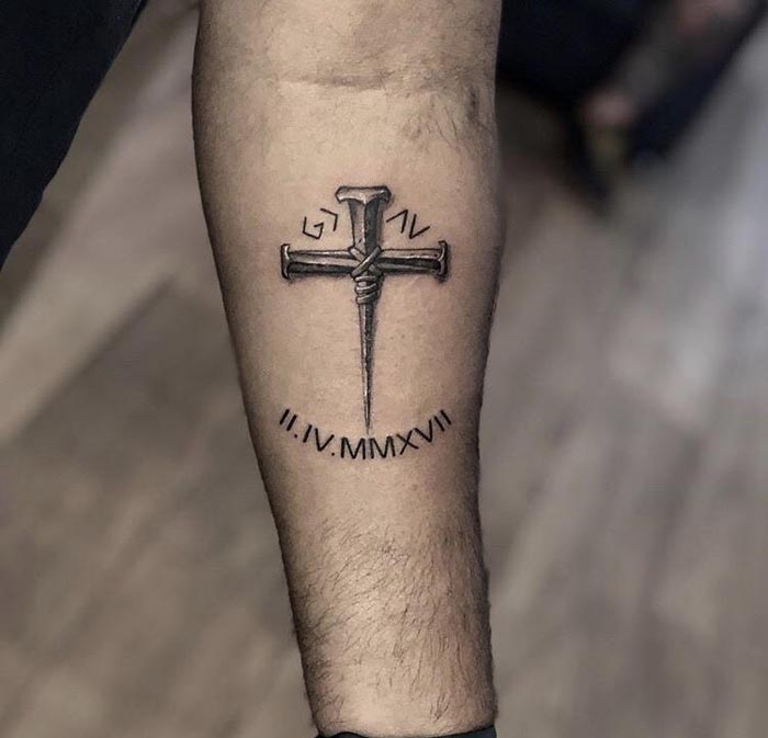 cross tattoo design on arm