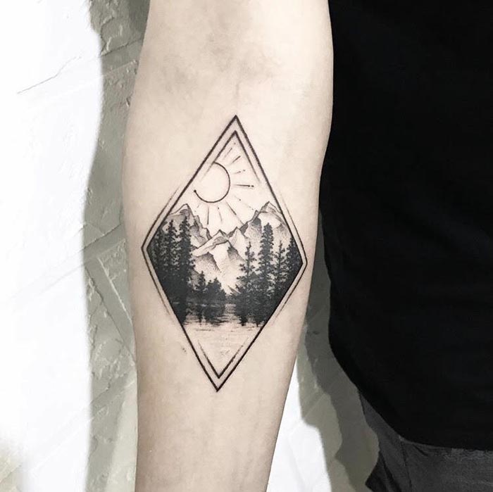 nature mountain tattoo on arm