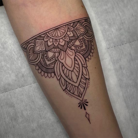mandala ornamental pattern lotus petals floral motifs lace armband tattoo female forearm