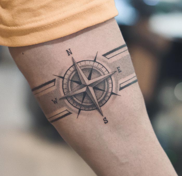 nautical compass rose north south east west letters armband tattoo male forearm