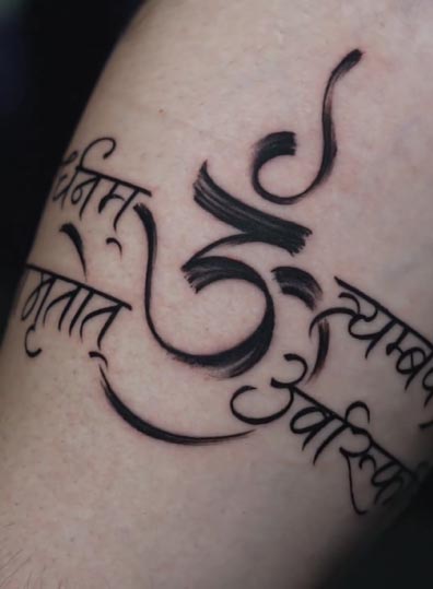om symbol maha mrityunjaya mantra sanskrit script armband tattoo male forearm