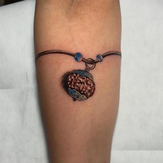 rudraksha bead pendant armband tattoo design color male forearm