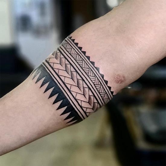 samoan patterns tribal geometric motifs armband tattoo male upper forearm