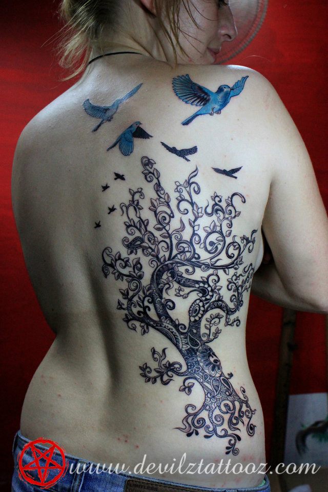 filigree tree blue bird tattoo