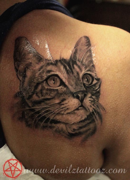 cat tattoo on back shoulder