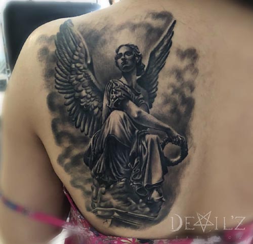 angelic woman tattoo on back shoulder