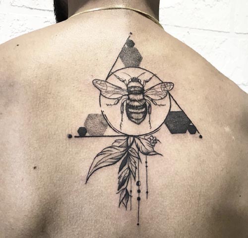 geometric customized tattoo on back
