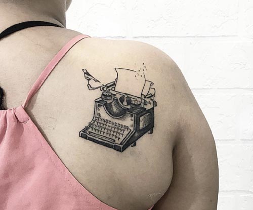 type writer tattoo on back shoulder