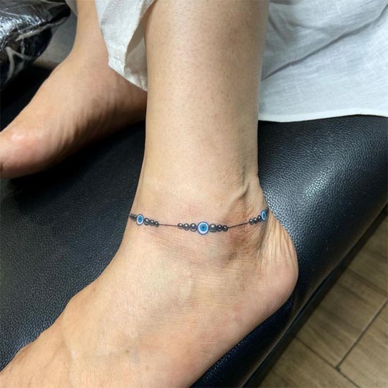 evil eye ankle bracelet tattoo design female