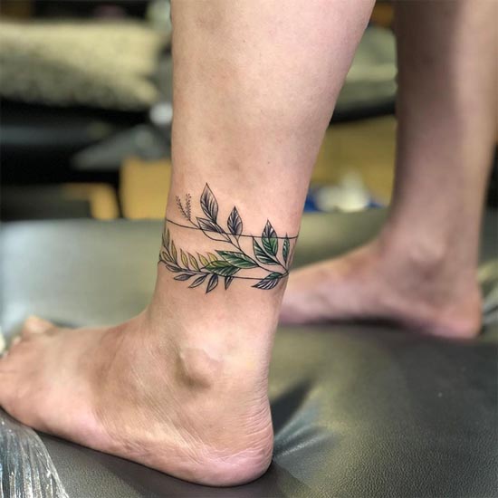 leg band with leaf tattoo above ankle