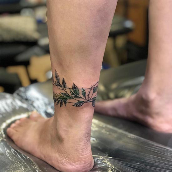 leg band with leaf tattoo above ankle