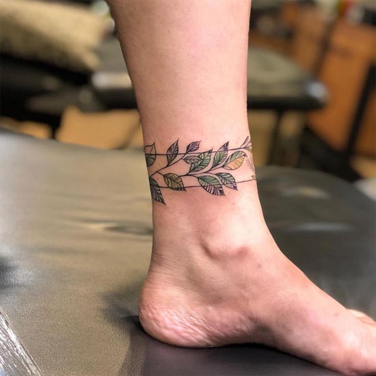 leg band with leaf tattoo above ankle