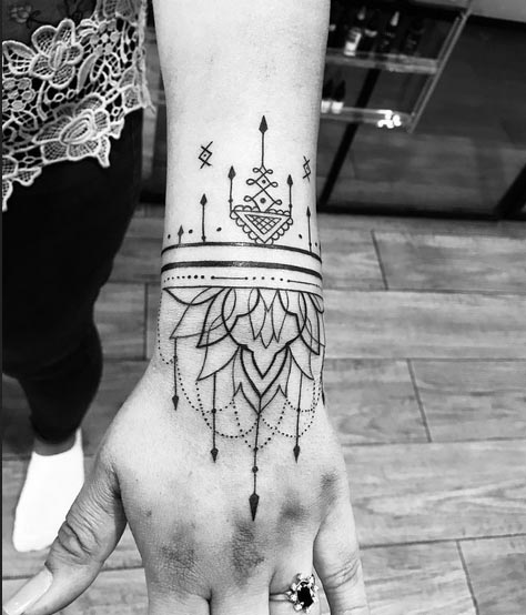 lotus wrist band tattoo design female