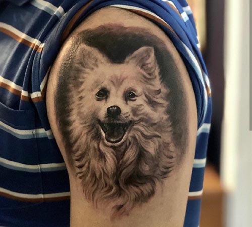 dog tattoo design on bicep