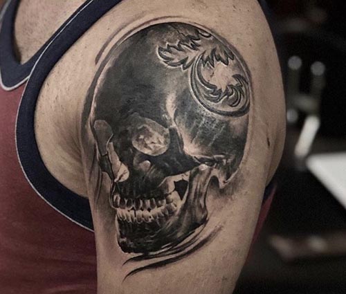skull photo tattoo on bicep