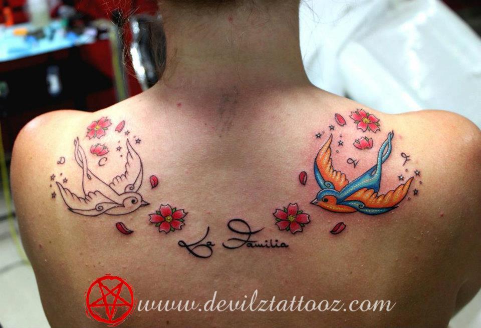 lafamilia swallow color back tattoo art