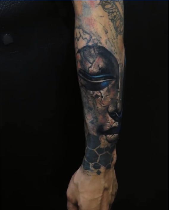 big buddha face tattoo male half sleeve black and grey 1
