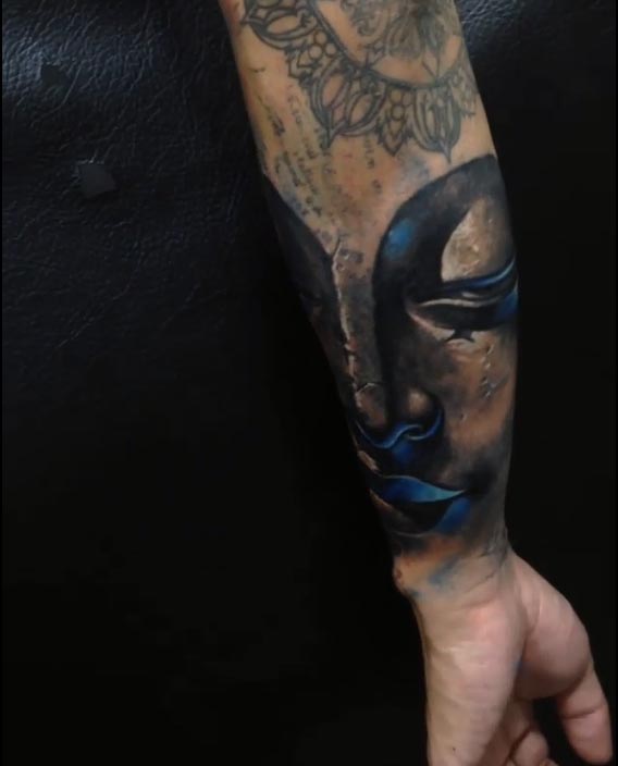 big buddha face tattoo male half sleeve black and grey 2