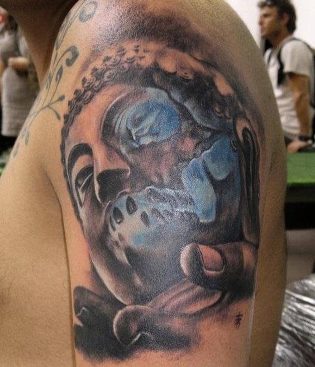 buddha face on hand tattoo design male shoulder bicep
