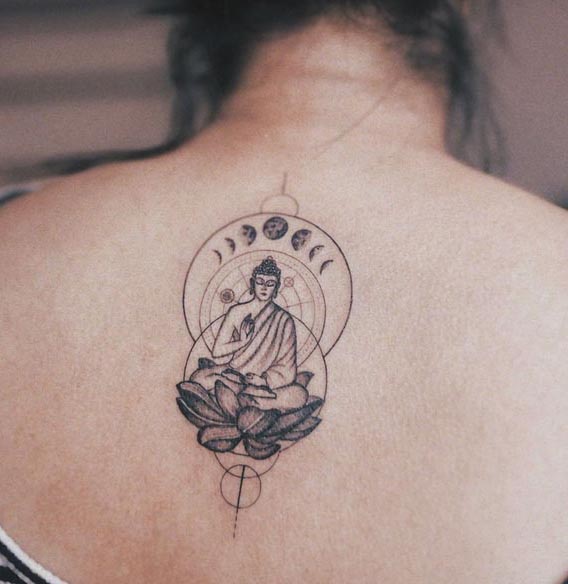 minimal buddha on lotus behing circles and moon phases tattoo female back