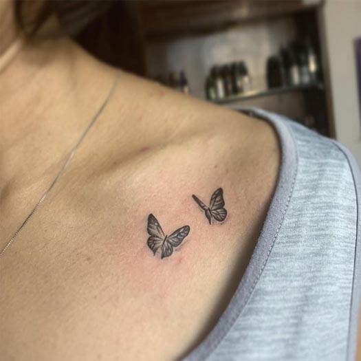 2 butterfly tattoo design female collarbone
