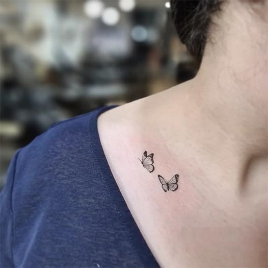 2 small butterfly tattoo minimal female collarbone
