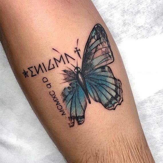 blue butterfly word enigma male hand forearm