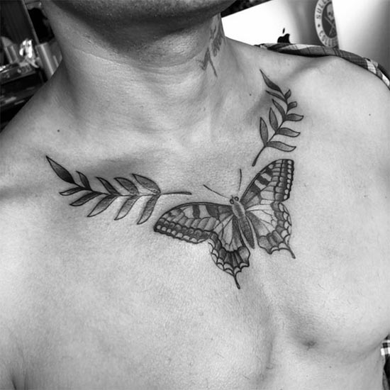 butterfly and laurel wreath tattoo design male chest