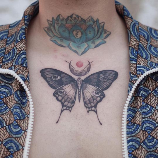 butterfly eyes on wings and crescent moon tattoo design male chest