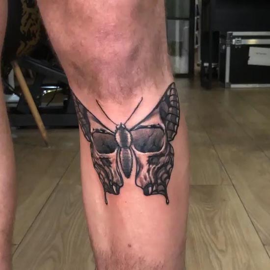 butterfly having skull on wings tattoo design male leg shin