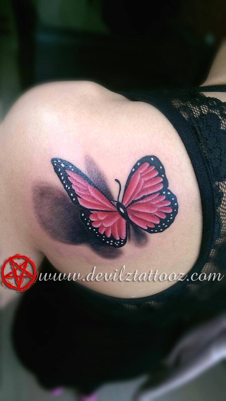 butterfly tattoo on female back shoulder