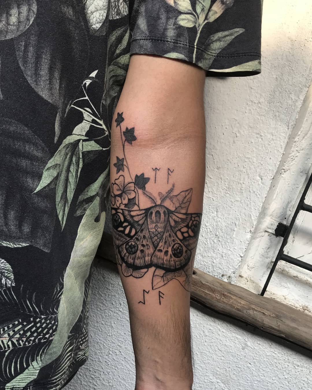 butterfly with ivy black and grey tattoo man forearm
