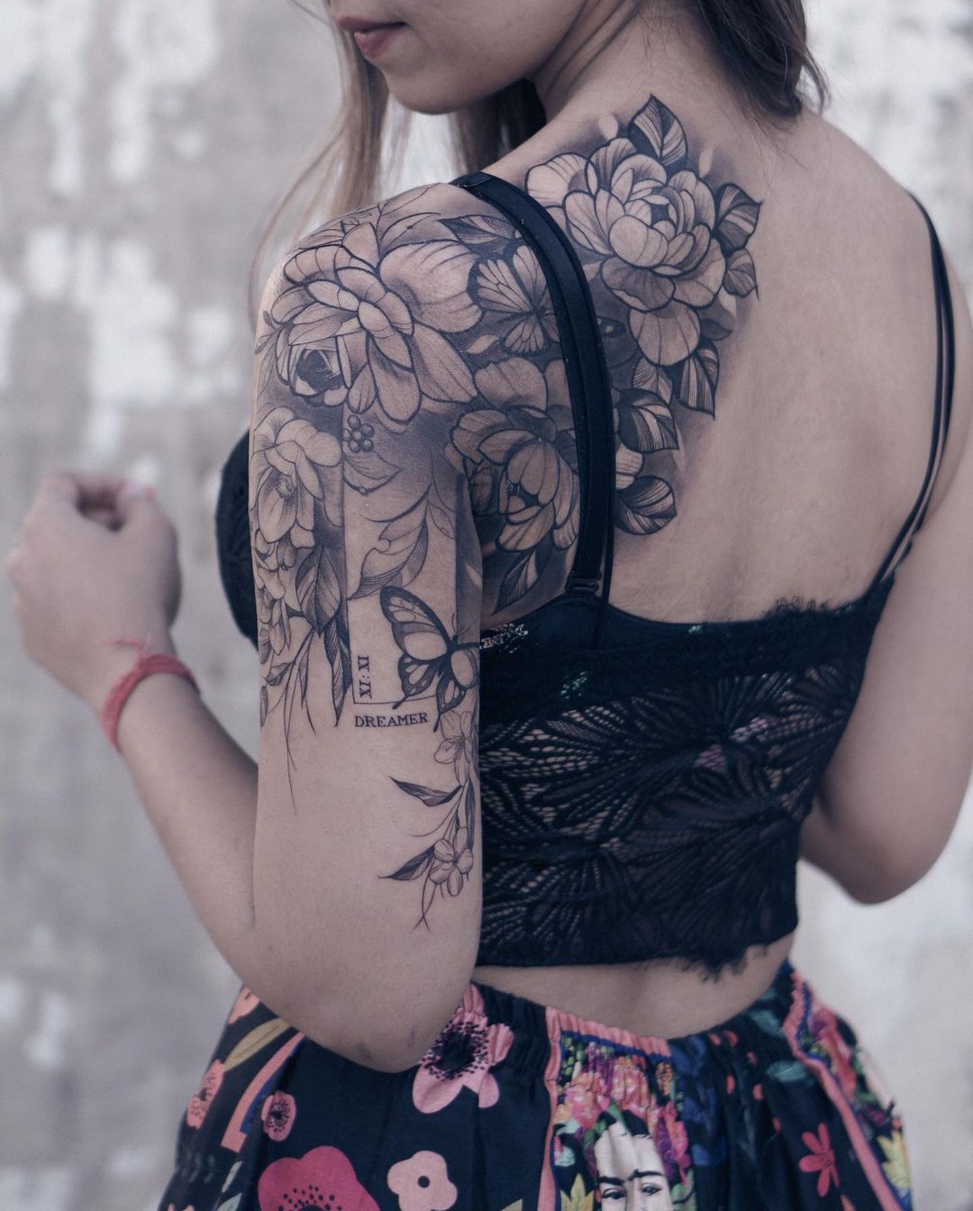 coverup birthmark with peony flowers butterfly tattoo female bicep shoulder blade