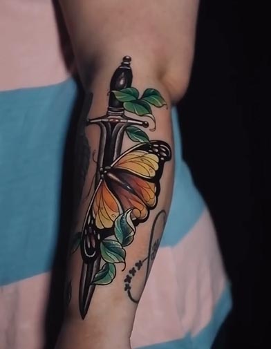 neo traditional butterfly dagger tattoo design color female outer forearm