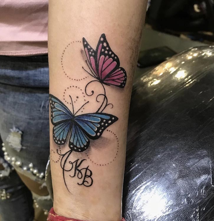 purple magenta 2 butterflies with name initials K B tattoo