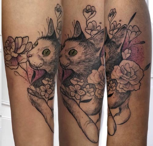 meek cat with flowers tattoo