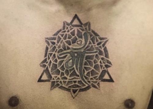 abstract maa tattoo on chest