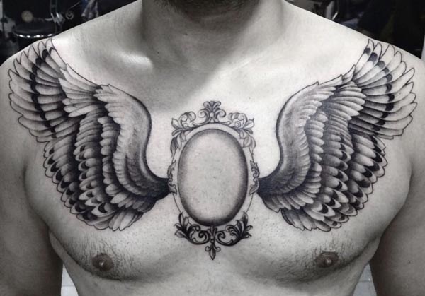 mirror with wings chest tattoo