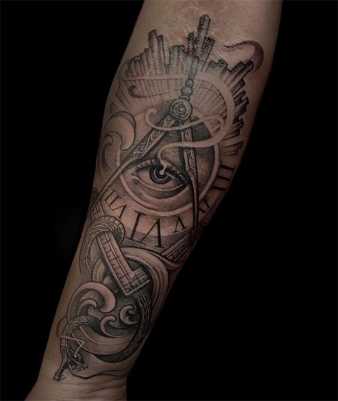 all-seeing-eye-clock-compass-divider-snake-ocean-waves-city-skyline-tattoo-male-forearm