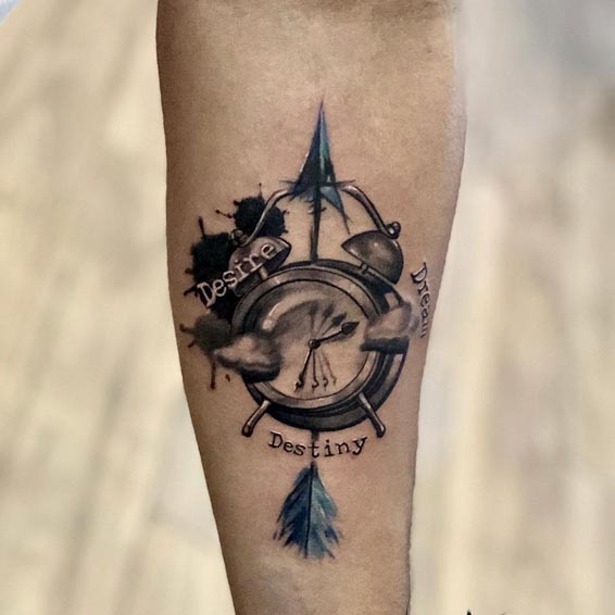 clock arrow feather clouds ink splashes quote tattoo male forearm