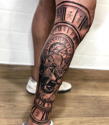 lion face crown clock mountain landscape trees forest tattoo male lower leg calf