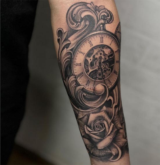 pocket watch clock roman numerals exposed gears rose ornamental scrollwork floral tattoo design male forearm