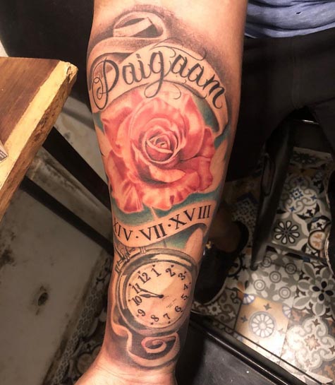 rose pocket watch name daigaan roman numerals date iv vii xviii tattoo male inner forearm