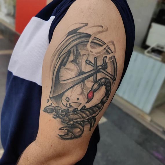 compass anchor nautical rope scorpion black and grey tattoo male outer bicep